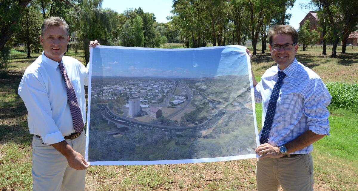 BIG PLANS: Gunnedah mayor Jamie Chaffey and Tamworth MP Kevin Anderson unveil plans for the new Gunnedah overpass on Wednesday afternoon. Photo: Billy Jupp