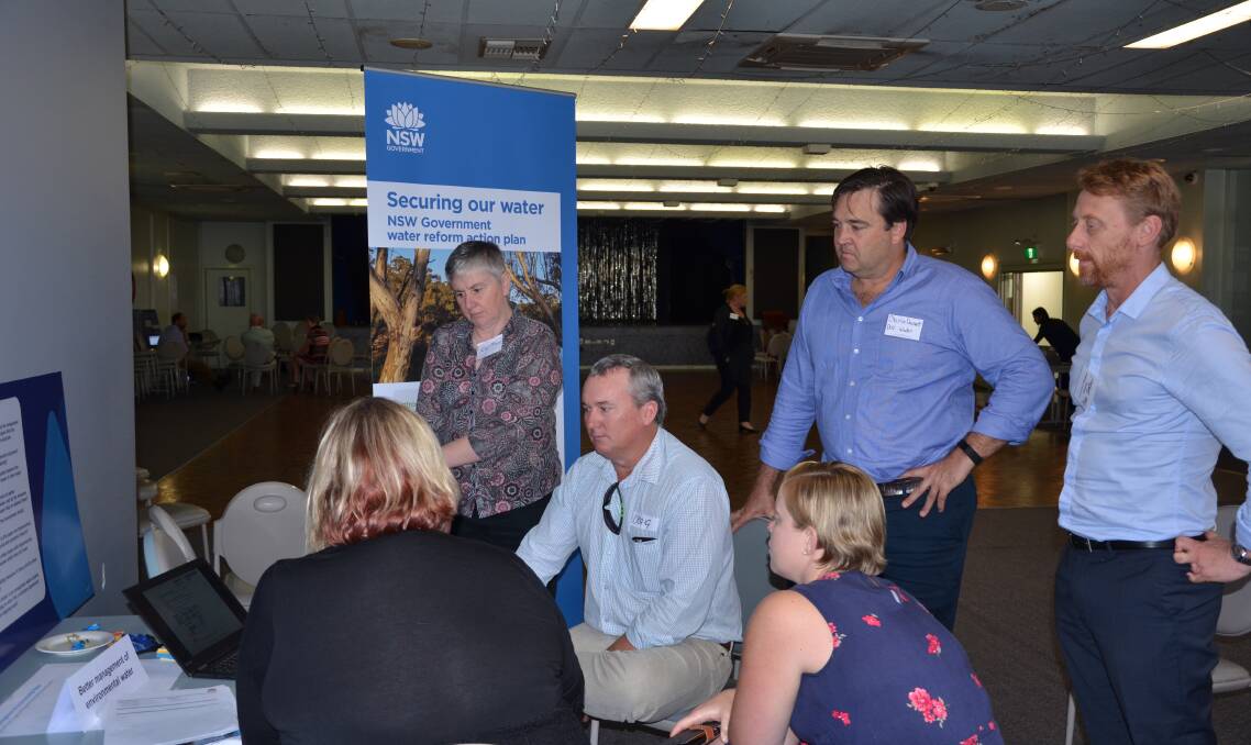 TEAMWORK: Members of the NSW Department of Industry and interested local parties discuss the Water Reform Action Plan at the Gunnedah Services and Bowling Club on Wednesday. Photo: Billy Jupp 