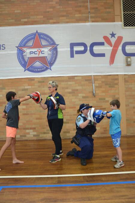 GETTING ACTIVE: Gunnedah PCYC's Michelle Gosper and Senior Constable Sarah Hobson put Tyler Ibraham and Cooper Mitchell through their paces ahead of the Fit for Life program. Photo: Billy Jupp 