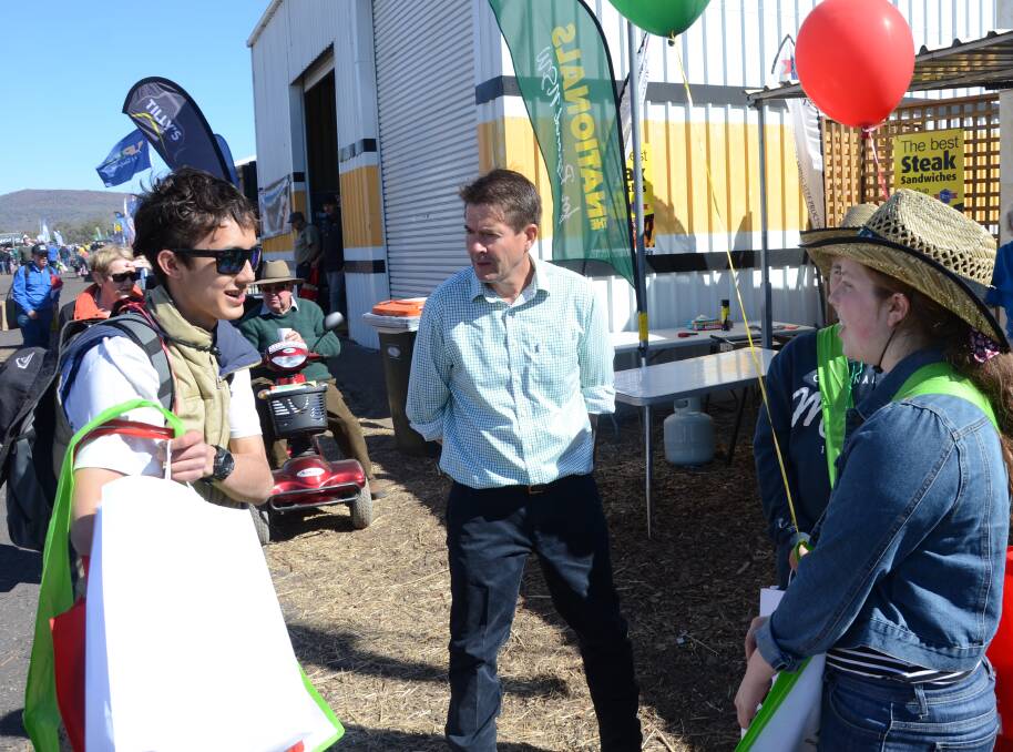EYE TO THE FUTURE: Tamworth MP Kevin Anderson fields questions from some of AgQuip's youngest visitors. Photo: Billy Jupp 