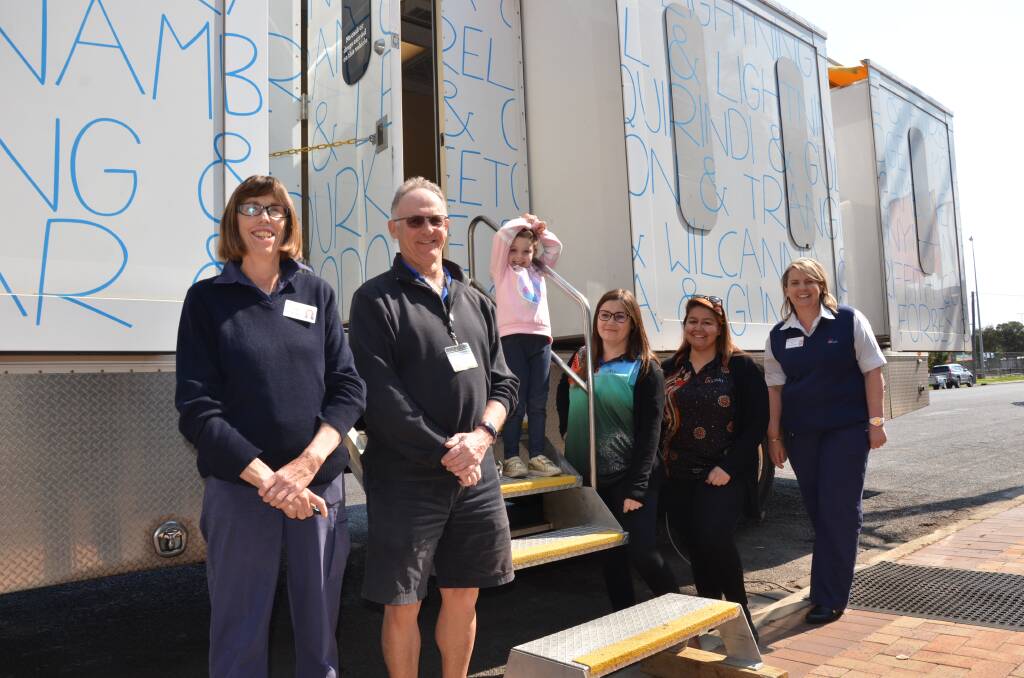 HERE TO HELP: Fiona Geddes, John Reid, Azaylia Roberts, Ashley Bender, Stephanie Cameron and Symone Fuller welcome the arrival of the Royal Far West kids health bus on Tuesday. Photo: Billy Jupp 