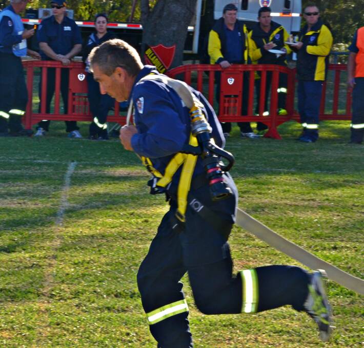 ON THE RUN: Teams will compete in events similar to the recent Regional Fire and Rescue Championships in Gunnedah to qualify for next year's Australasian Championships in Tamworth. Photo: Billy Jupp
