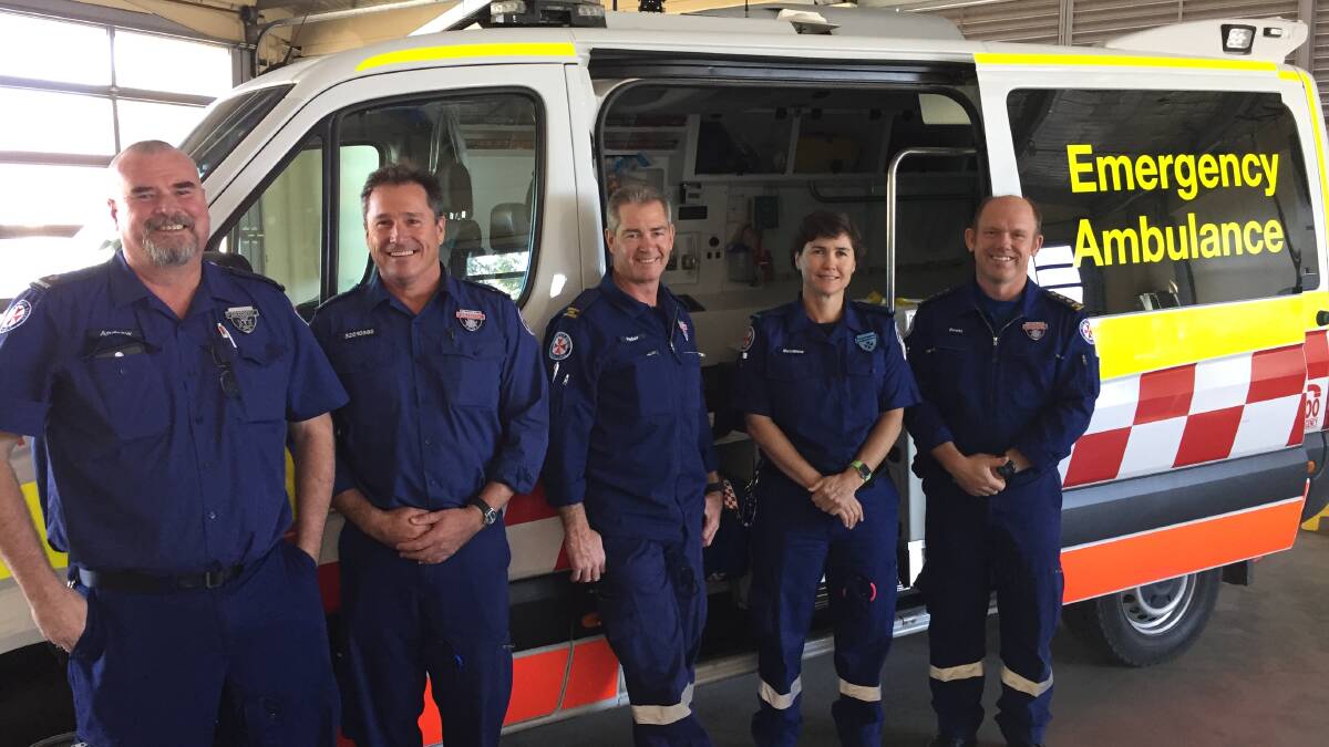 MAJOR MILESTONE: The team from Gunnedah ambulance service help Peter Patterson and David McAllan celebrate 30 years on the job. Photo: Billy Jupp 