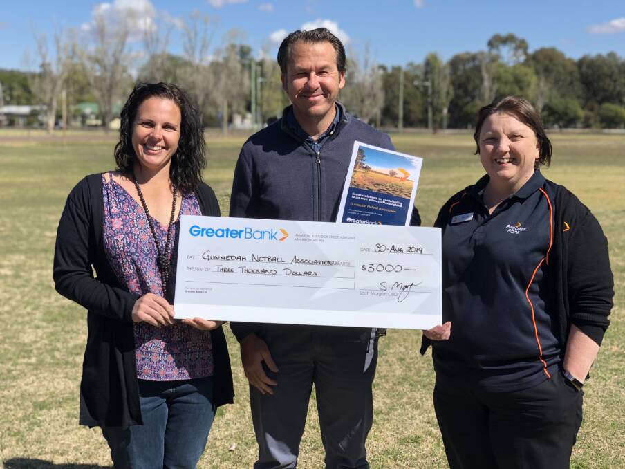 HELPING HAND: Gunnedah Netball Associations Jen Muddle and Steven Betts celebrate their successful funding application with Greater Banks Tammy Megson. Photo: Supplied 