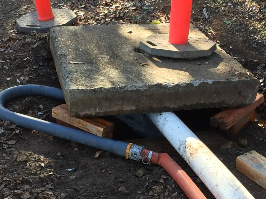 DOWN THE DRAIN: Gunnedah Shire Council began pumping testing water from the Gunnedah pool into a storm water drain on Wednesday. Photo: Billy Jupp 