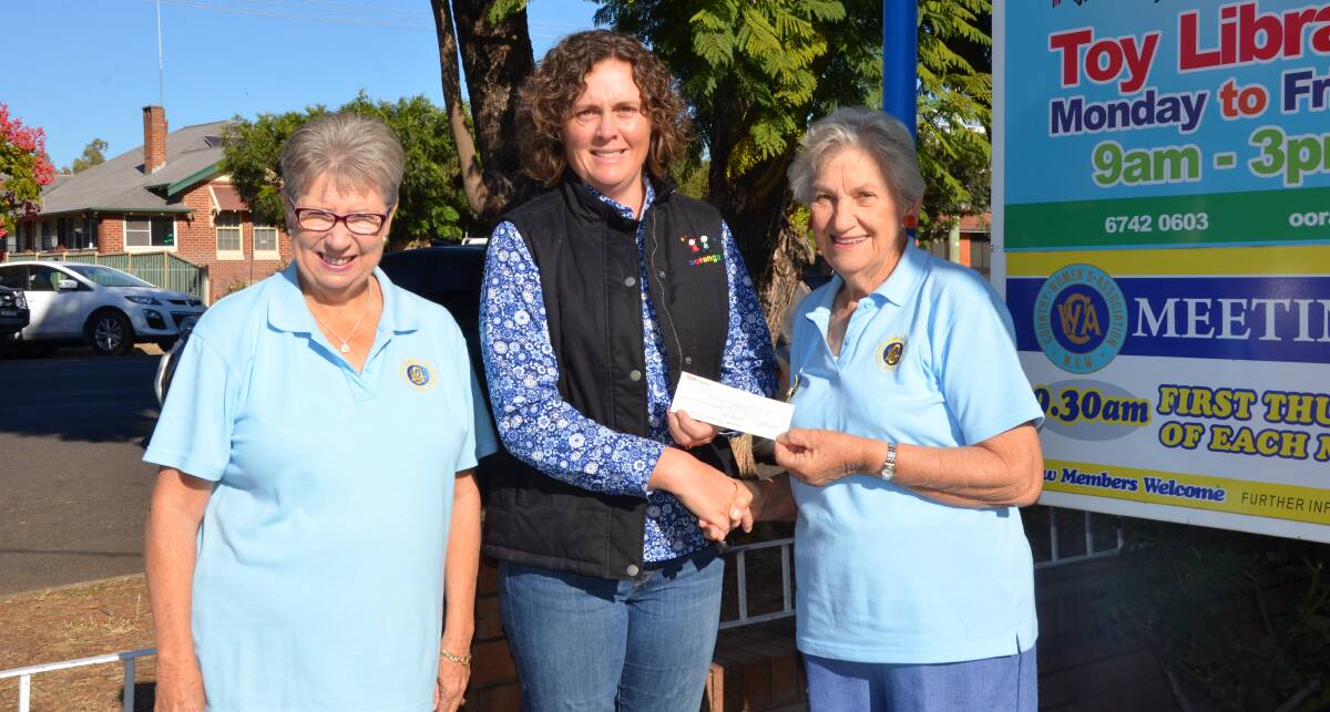 PITCHING IN: Gunnedah CWA members Kris Scott and Coralie Howe hand over a donation of $1000 to Ooranga Pre School and Royal Far West working group member  Rebecca Dridan. Photo: Billy Jupp 
