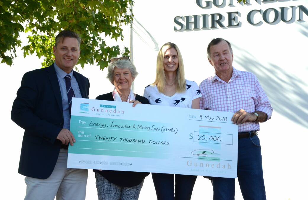 MOVING FORWARD: Gunnedah mayor Jamie Chaffey presents the Gunnedah Show Society members with a cheque of support for the society's upcoming eIMEx. Photo: Billy Jupp 