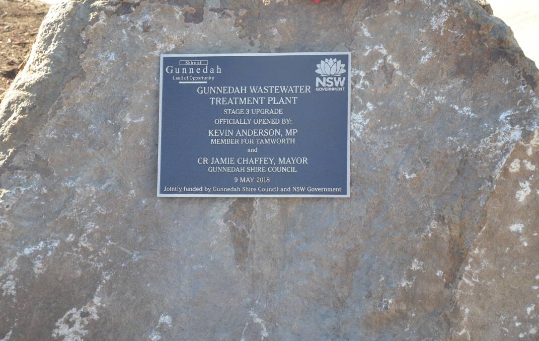 SET IN STONE: The occasion was marked with a sandstone taken from the Apex Road Reservoir upgrade. Photo: Billy Jupp
