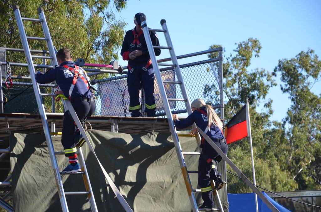 GOING FOR IT: Teams competed in a variety of different competitions at the recent Regional Fire and Rescue Championships in Gunnedah. Photo: Billy Jupp 