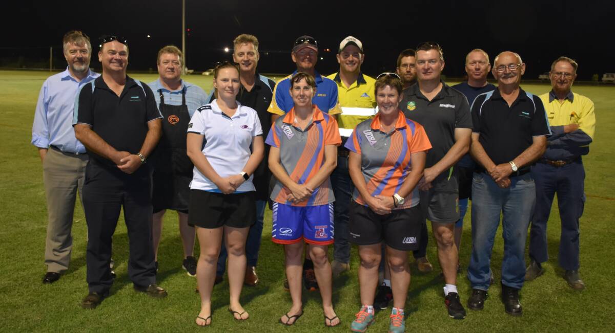SWITCHED ON: Members of Gunnedah Shire Council and the Gunnedah Touch Football Association under the new flood lights. Photo: Supplied 