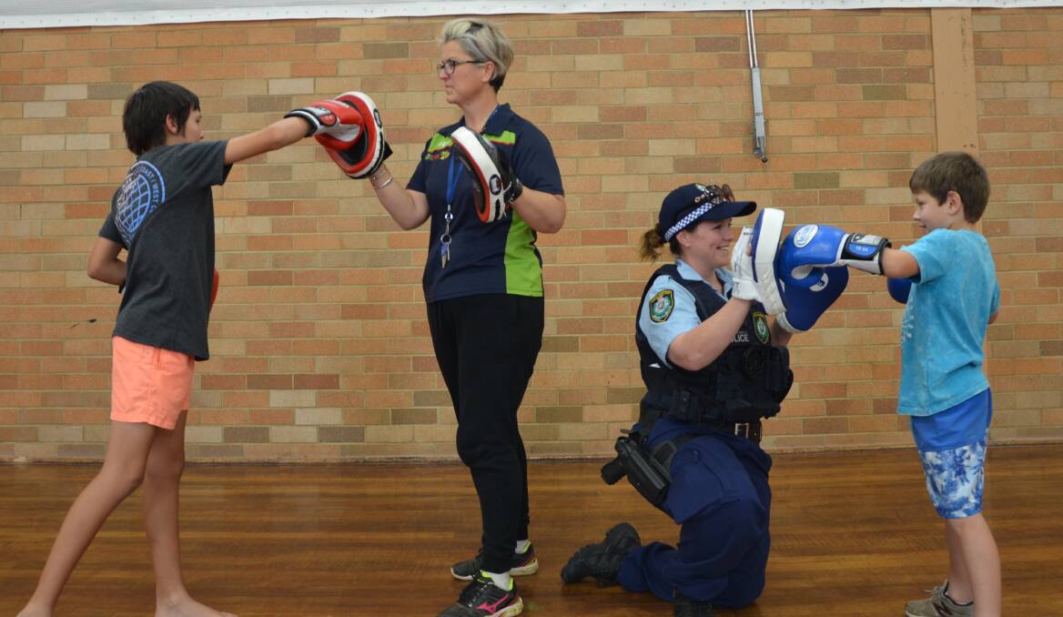 GETTING ACTIVE: Gunnedah PCYC's Michelle Gosper and Senior Constable Sarah Hobson put Tyler Ibraham and Cooper Mitchell through their paces ahead of the Fit for Life program. Photo: Billy Jupp 