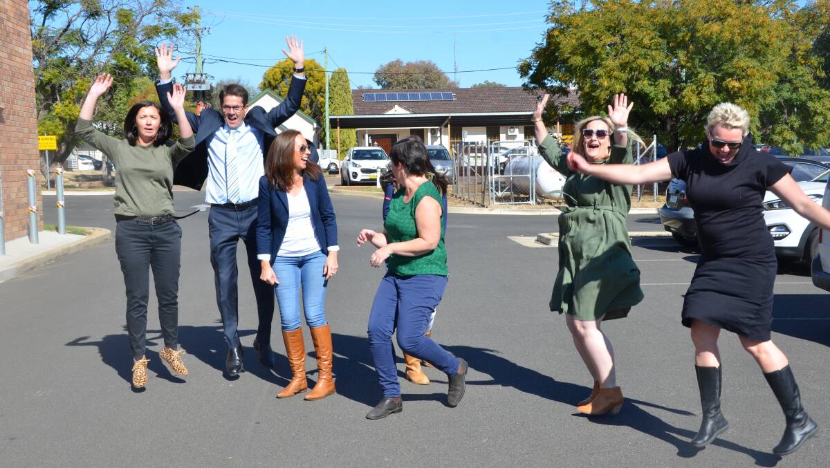 JUMP FOR JOY: Tamworth MP Kevin Anderson and Gunnedah PRAMS members celebrate the announcement of funding for an upgrade of Gunnedah Hospital. Photo: Billy Jupp 