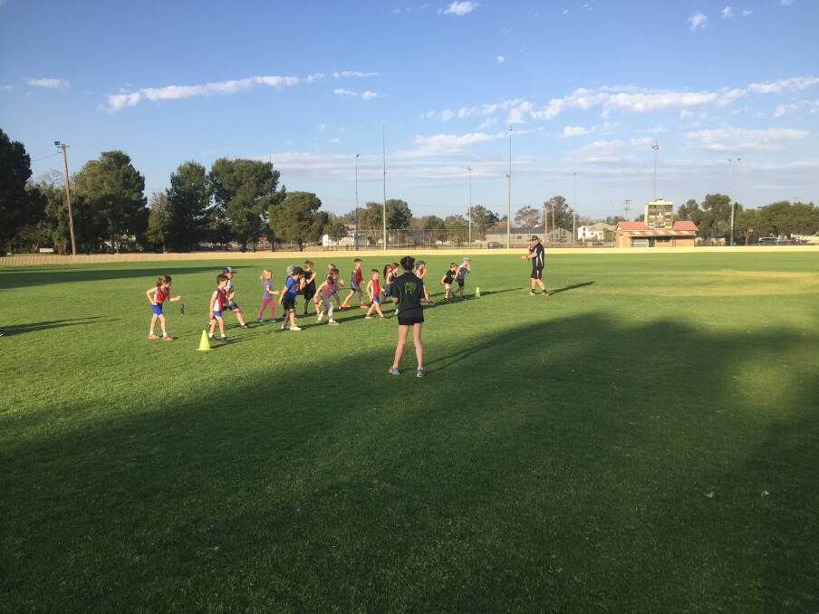 ON YOUR MARKS: Kids try their hand at the 100m sprint at Gunnedah Little Athletics club come and try day. Photo Supplied. 