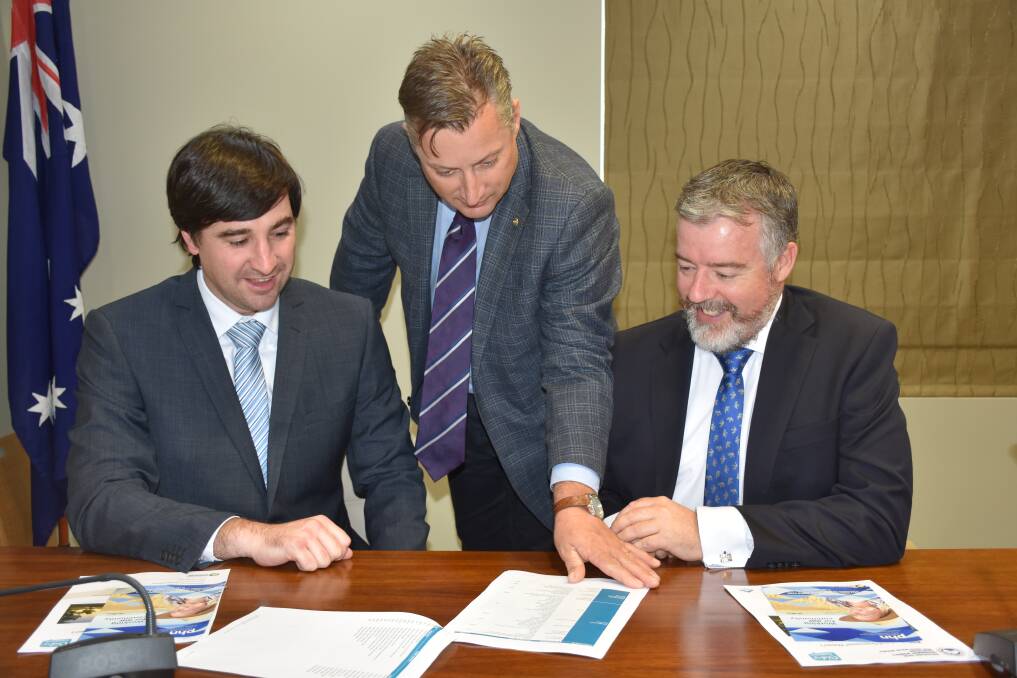 MOVING FORWARD: Gunnedah Shire Council's director of corporate and community services Colin Formann, mayor Jamie Chaffey and general manager Eric Groth discuss the draft 2018/19 Operational Plan. Photo: Supplied 
