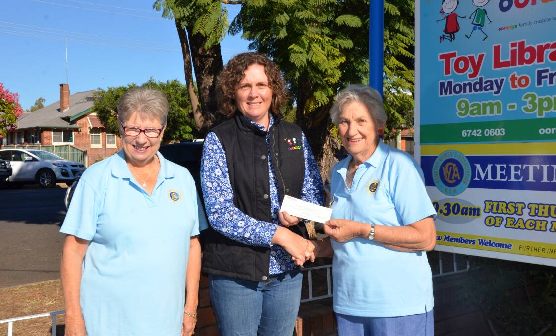 ARRIVED: Every Gunnedah Child working group member Rebecca Dridan pictured here accepting a donation from the Gunnedah CWA. Photo: Billy Jupp 