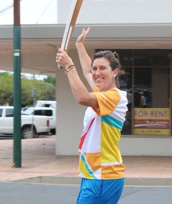 ALL SMILES: Gunnedah's Sara Carrigan was among 27 locals to carry the Queen's Baton through Gunnedah on Tuesday. Photo: Marie Low