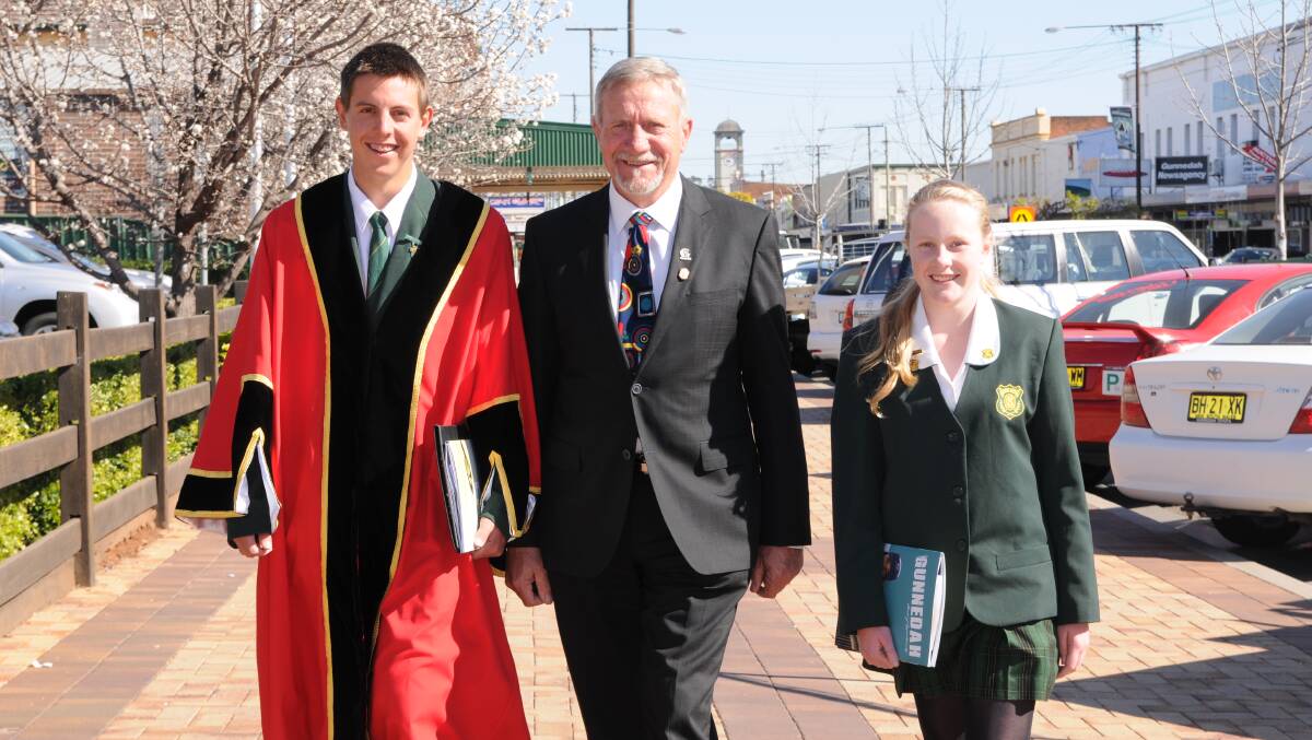 GIVE IT A GO: Former Gunnedah High School students Josh Day and Courtney Brandon with then Mayor Cr Owen Hasler during the 2013 mayor for a day.