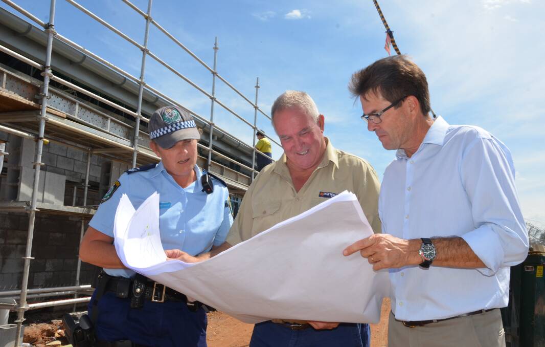 UNDER WAY: Bree Olsen, Patterson Group's Bob Mudie and Tamworth MP Kevin Anderson take in the progress of the Gunnedah Police Station upgrade. Photo: Billy Jupp 