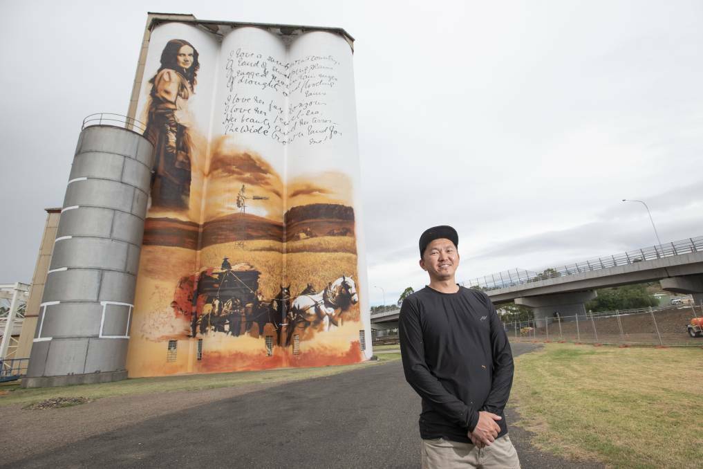 Heesco shows off his almost done Gunnedah Maize Mill mural.