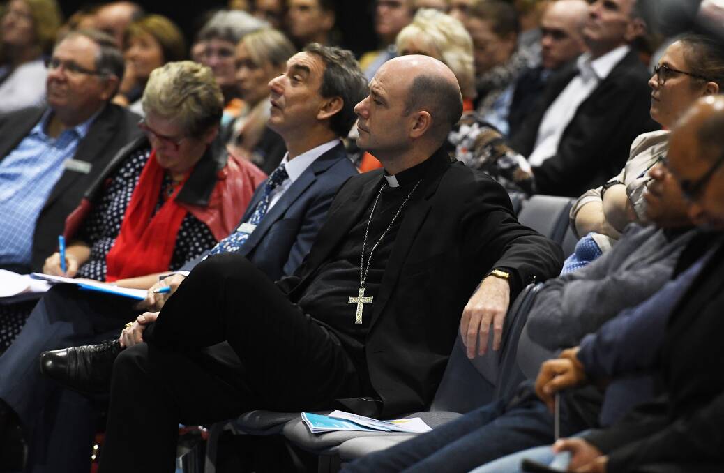 Learning: Armidale diocese director of schools Chris Smyth and Bishop Michael Kennedy in the audience on day 1. Photo: Gareth Gardner Armidale 110619GGB12