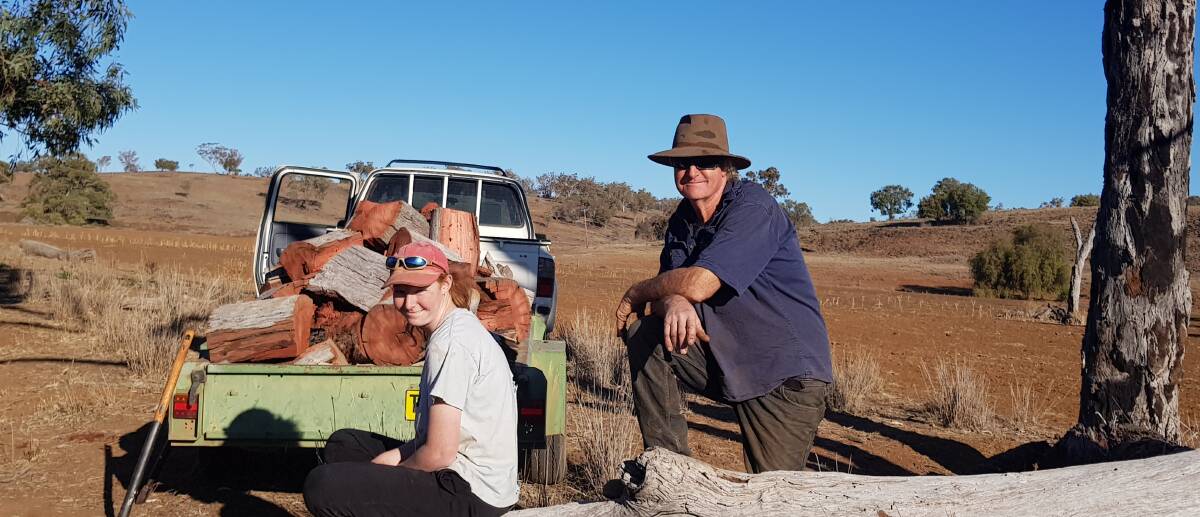 HELPING HAND: Lillie and her dad Les Jones of Goolhi, near Gunnedah. They are struggling with water for not only their stock but their household, and with feeding their animals.