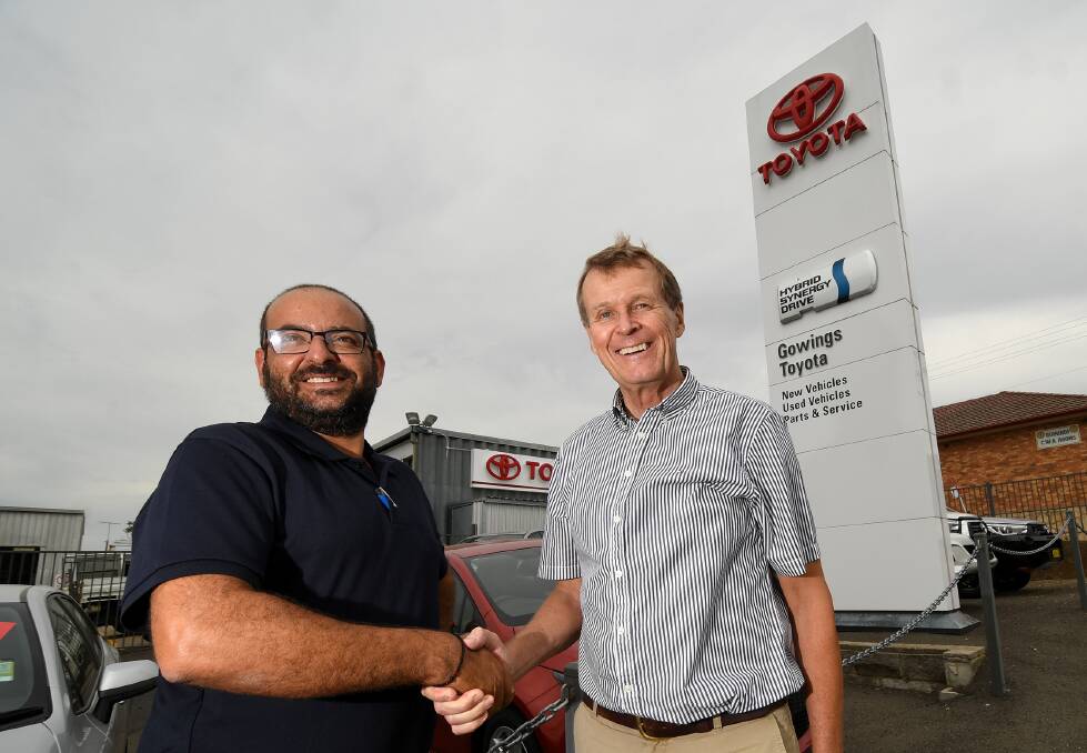 DEALERSHIP DEAL: New and former owner-managers John Drakoulis and Bruce Gowing. Photo: Gareth Gardner 310119GGB27