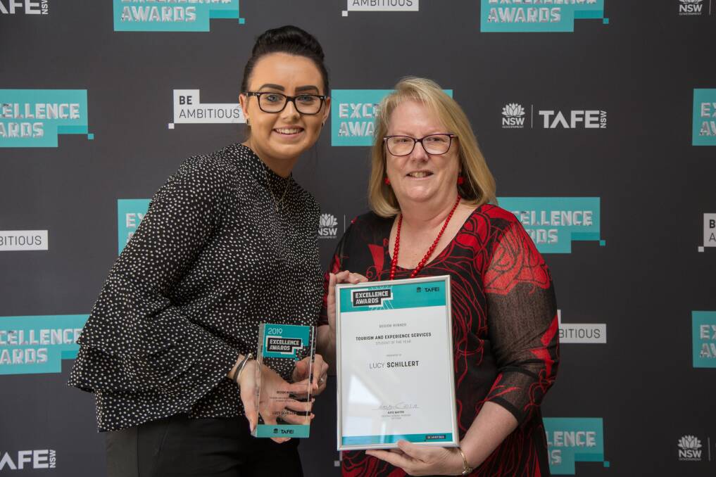 WHAT A WIN: Gunnedah's Lucy Schillert, who works for Delma Hayne at Etcetera Skin Therapy, receives her award from TAFE NSW regional general manager Kate Baxter.