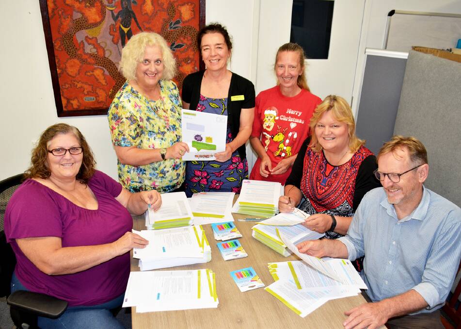 INFO COMING: Homes North Community Housing volunteer Jenny Hazell from Gunnedah, service development officer Nickie Murcell, chief executive Maree McKenzie, volunteer Rose Smith from Tamworth, resident engagement officer Joy Wilson and project officer Andrew Parker pitch in to get the information mailed out.