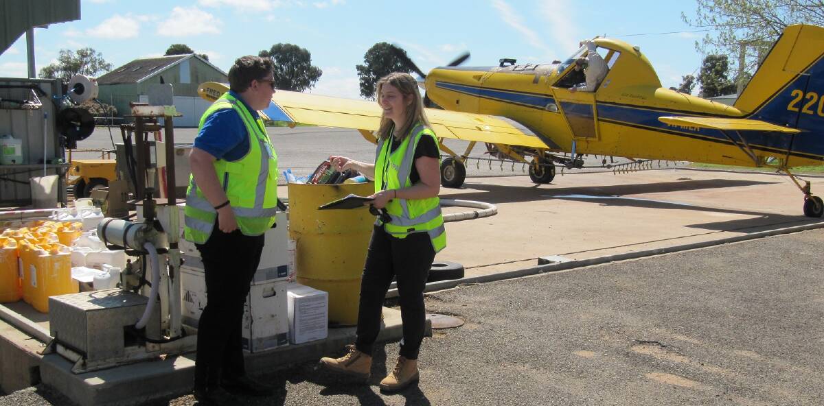 Compliance checks: EPA officers completing a routine inspection of aerial sprayers in Mudgee last month.