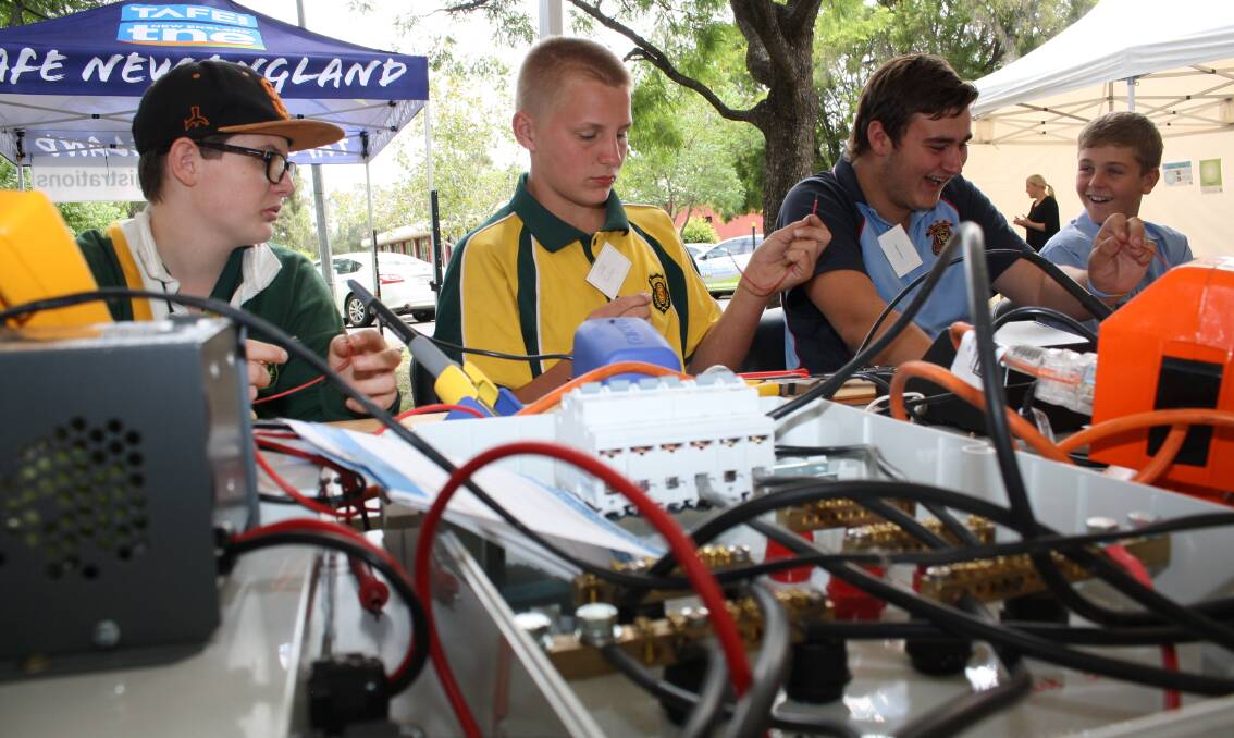 Hands on: Students try out an electrical-related career during Gunnedah's Try A Trade event, hosted by TAFE New England and Gunnedah Chamber of Commerce. Photo: Sam Woods