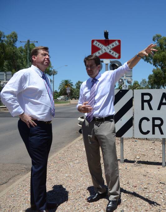 Former deputy premier Troy Grant and local member Kevin Anderson at the proposed Gunnedah overpass site.