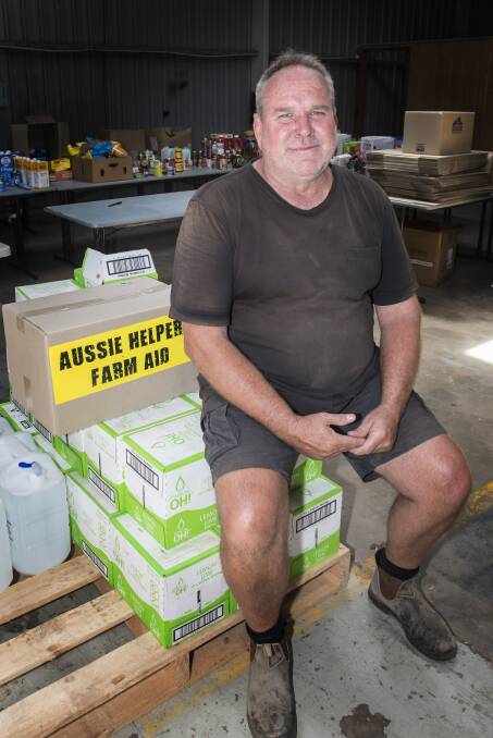Helping hand: Aussie Helpers co-ordinator Peter Fanning was "blown away" after AgQuip organisers donated 400 hay bales to local farmers. Photo: Peter Hardin