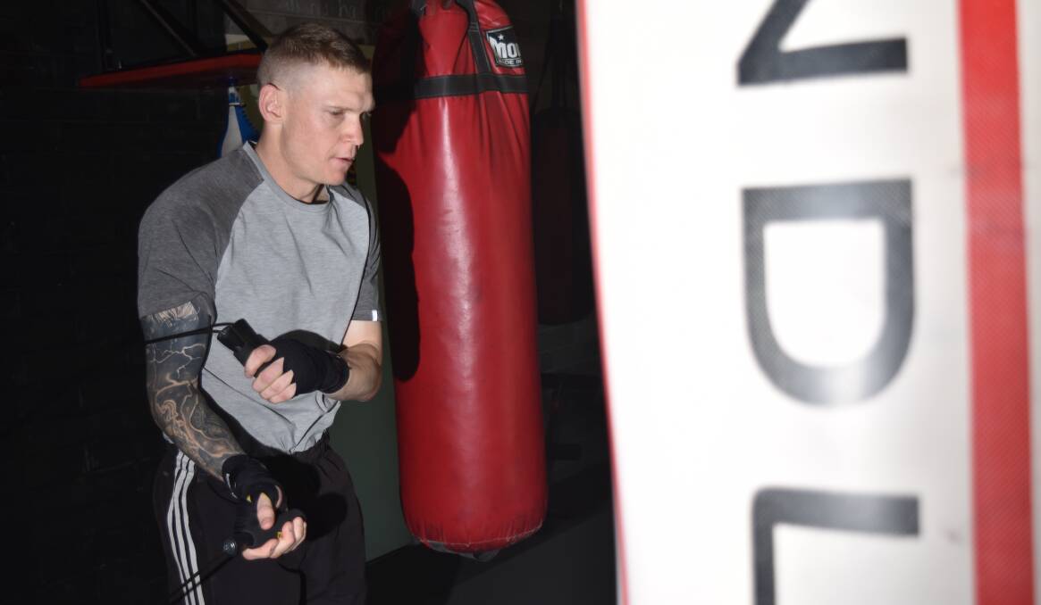 PUTTING IN THE WORK: Wade Ryan warms up for a training session at Black N Blue Boxing Gym. Photo: Ben Jaffrey