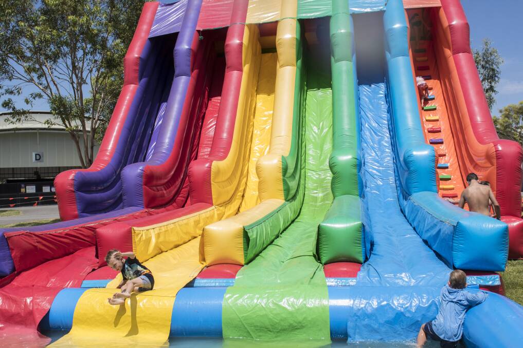 FUN: The inflatable water slides were popular last year but a lack of water will mean they won't be back in 2020. Photo: Peter Hardin