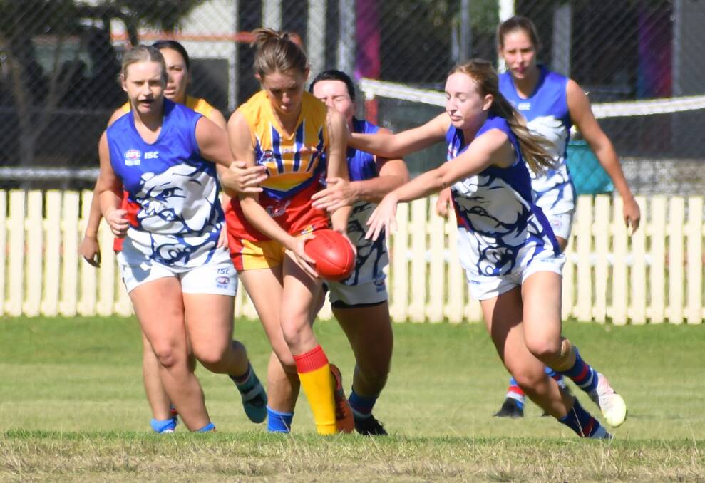 TACKLE: Chloe Sumpter, right, helps take down a Moree player on the weekend. Photo: Raul de Leon Lopez