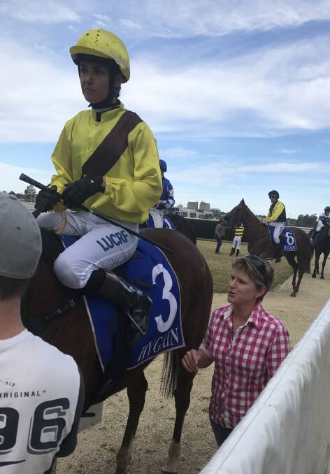 SIZZLING SPEED: Sally Torrens talks with winning jockey Belinda Hodder as they return to the winner's stall with Guilty As Sin. Photo: Supplied