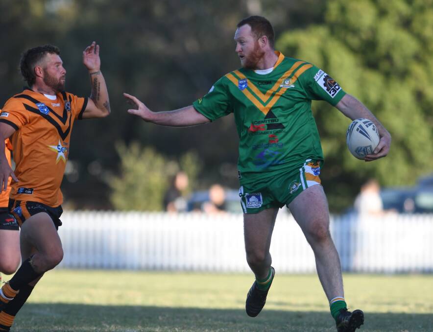 IMPACT IMMINENT: Roos prop Nick Lyons gets some Doring attention.