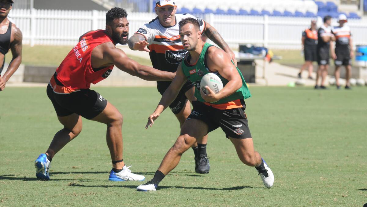 EXPLOSIVE: Tigers No 7 Luke Brooks goes for a gallop at training at Scully Park this week. Photo; Ben Jaffrey