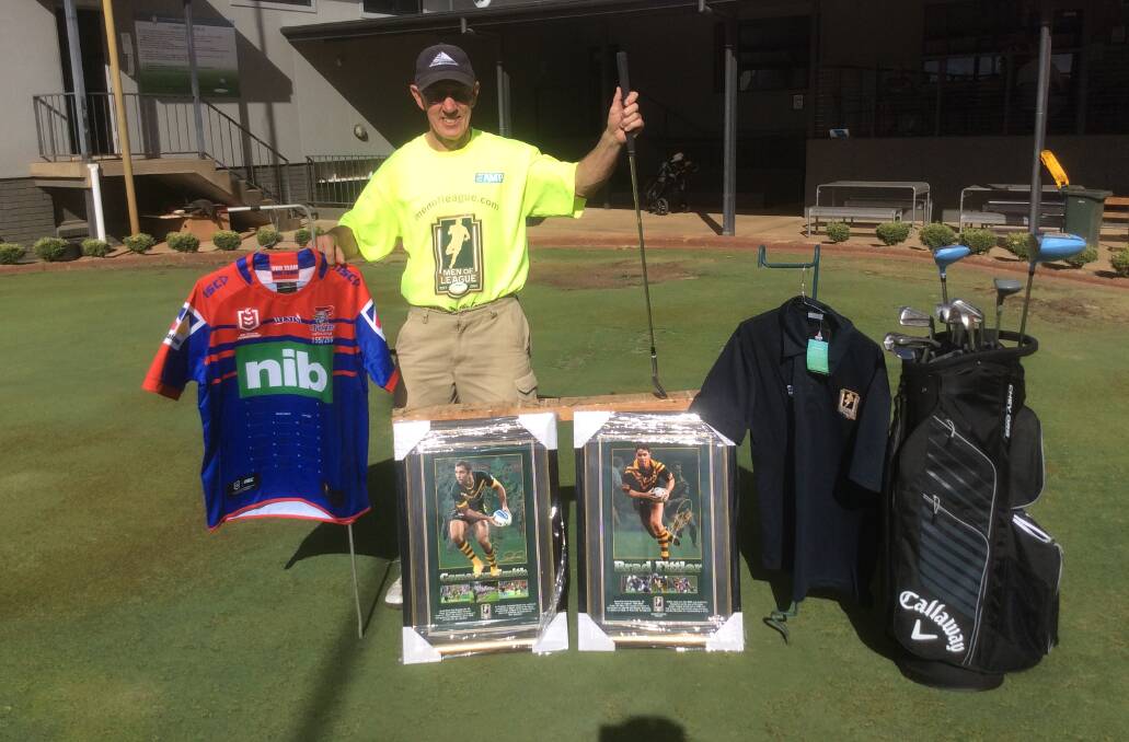 MAN OF ACTION: Peter Haley, of Men of League, with auction items for Sunday's golf day. 