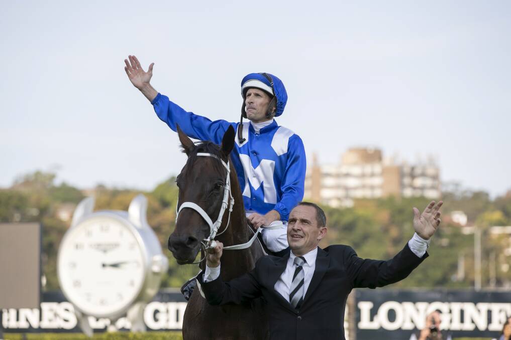 FAREWELL, GIRL: Hugh Bowman and trainer Chris Waller celebrate Winx's win at Randwick on April 13 - her last race. Photo: Brook Mitchell