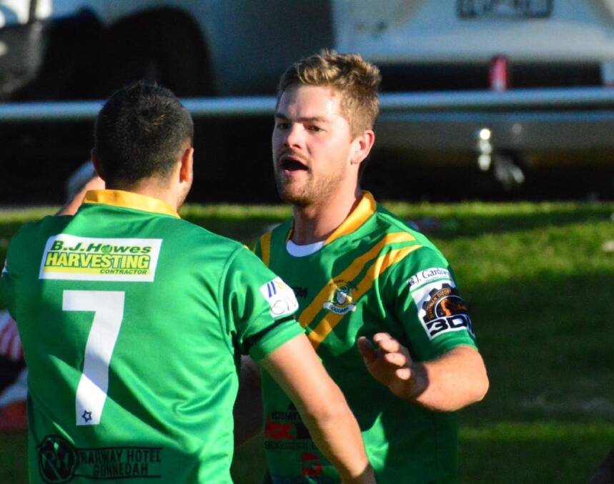 REWIND: Roos No 7 Josh Trindall congratulates Matt Gillham after the latter's try on Sunday. Photo: Sue Haire