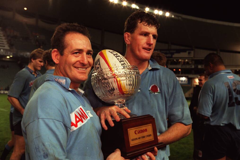 EXCLUSIVITY: Tim Gavin, right, and fellow Hall of Fame member David Campese celebrate a special Waratahs moment. 