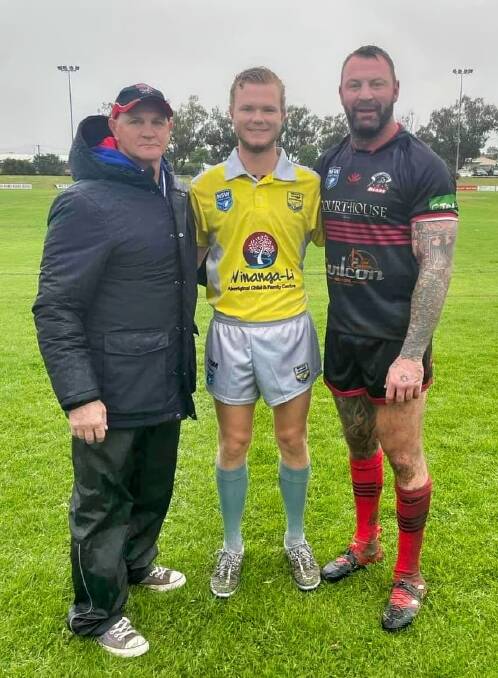 THE CLAN: Bulldogs coach Mick Schmiedel with his sons, Ryan and Josh. In a Facebook post, Josh said: "Sharing our love with a family affair today and a first for us with Dad coaching the Gunnedah Bulldogs first grade team, my little brother refereeing the game and myself captain of the North Tamworth Bears."
