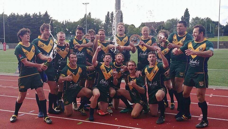 AUSSIE ABROAD: Jordy Ford (third from the left on a knee) celebrates Hammersmith Hills Hoists' 2017 grand final win in London. 