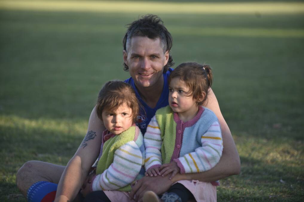 FOR POSTERITY: Brendon Lemon and his daughters, Edie (left) and Clara, after the grand final. Photo: Mark Bode