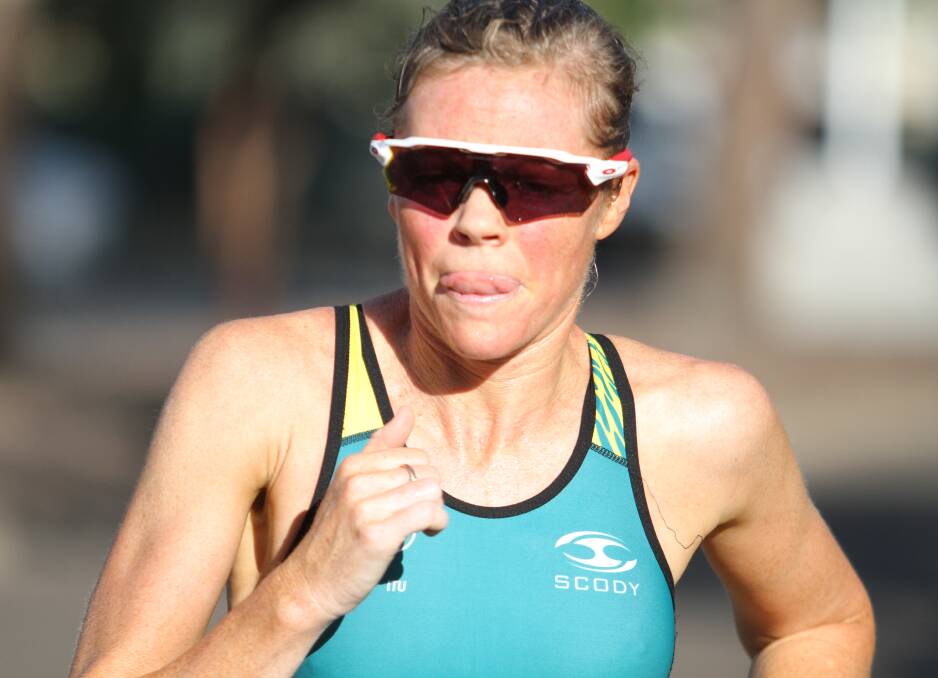 TRUE GRIT: Mother-of-three Kelly Watson en route to winning the Gunnedah Australia Day Triathlon. Photo: Mark Bode 