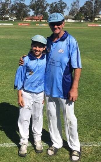 APPLE AND TREE: Darrin Cameron and his son, Jonah, after they played together for Court House this year. Photo: Supplied