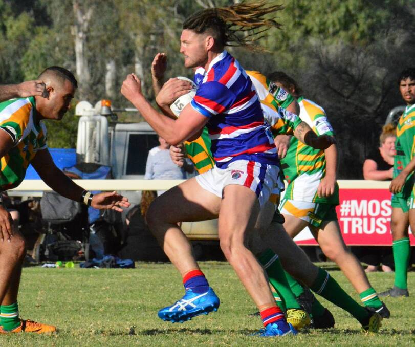 RAMPAGING: Bulldogs forward Jacko Brookman looks to inflict damage. Photo: Sue Haire