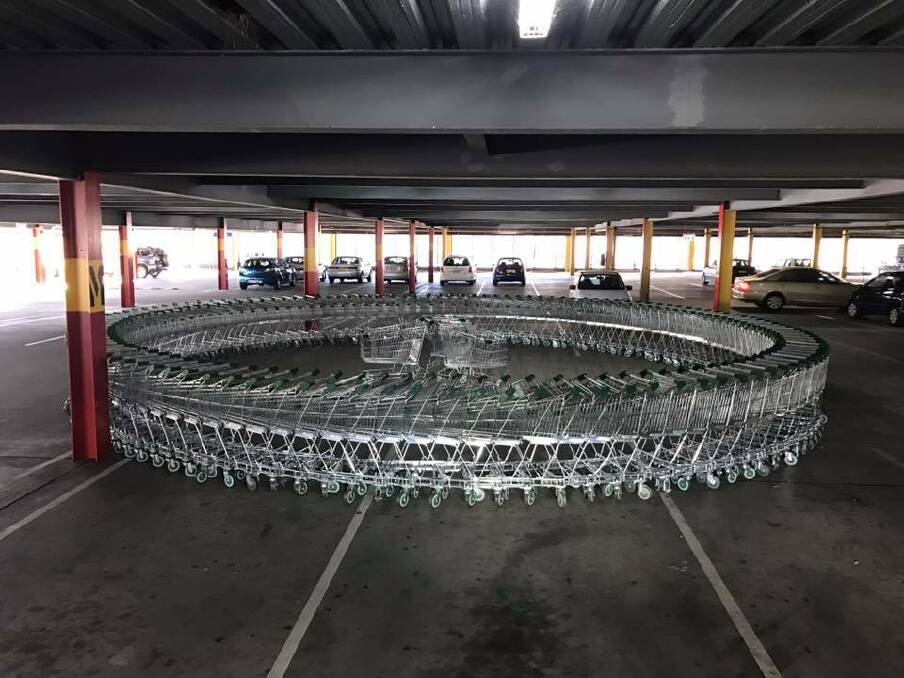 WORK OF ART: A circle of trolleys appearing in the car park at Armidale Central has been applauded by local residents. Photo: Thumbs Up, Thumbs Down Armidale via Vanessa Henderson.