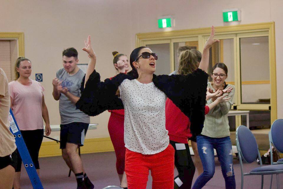 NEW DATE: Gabriela McDonald as Donna from Mamma Mia! with other cast members at rehearsal. Photo: Mitch Alcorn